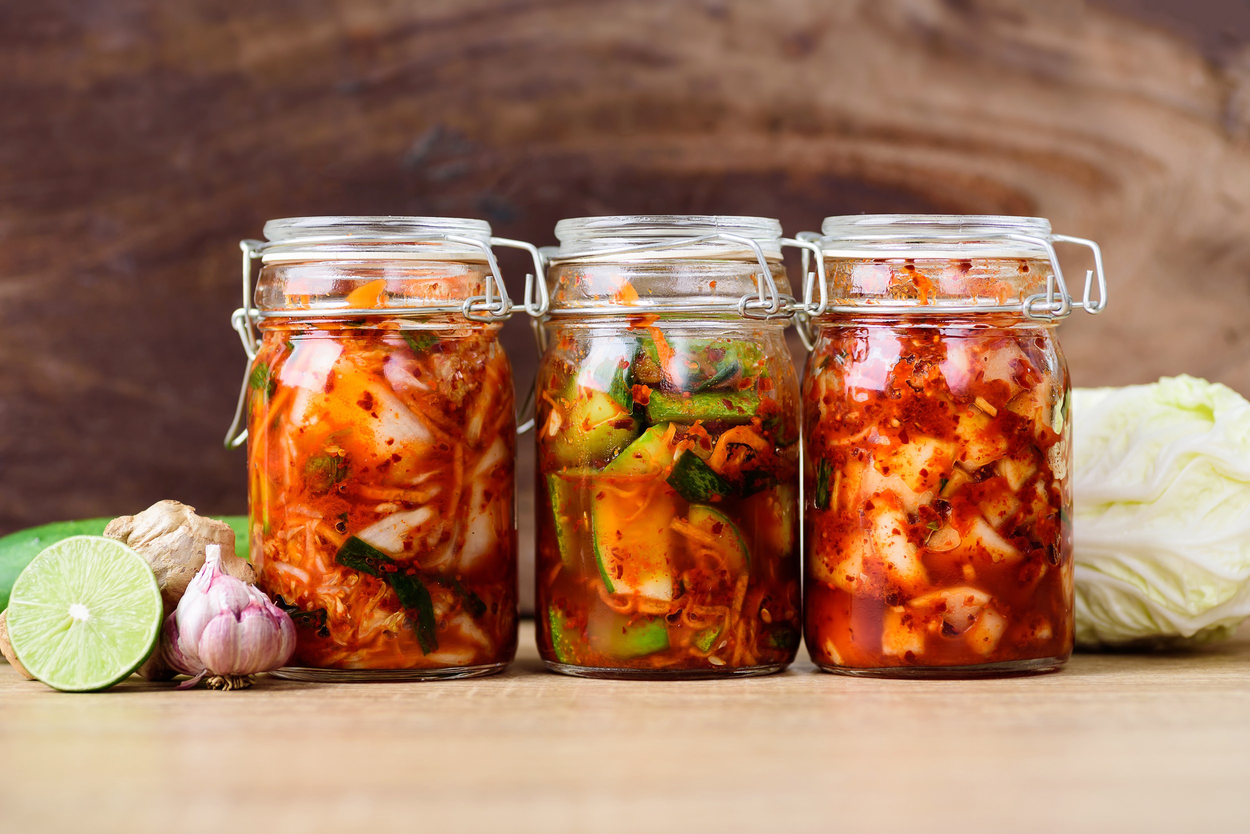 Glass containers of soup ready for the freezer