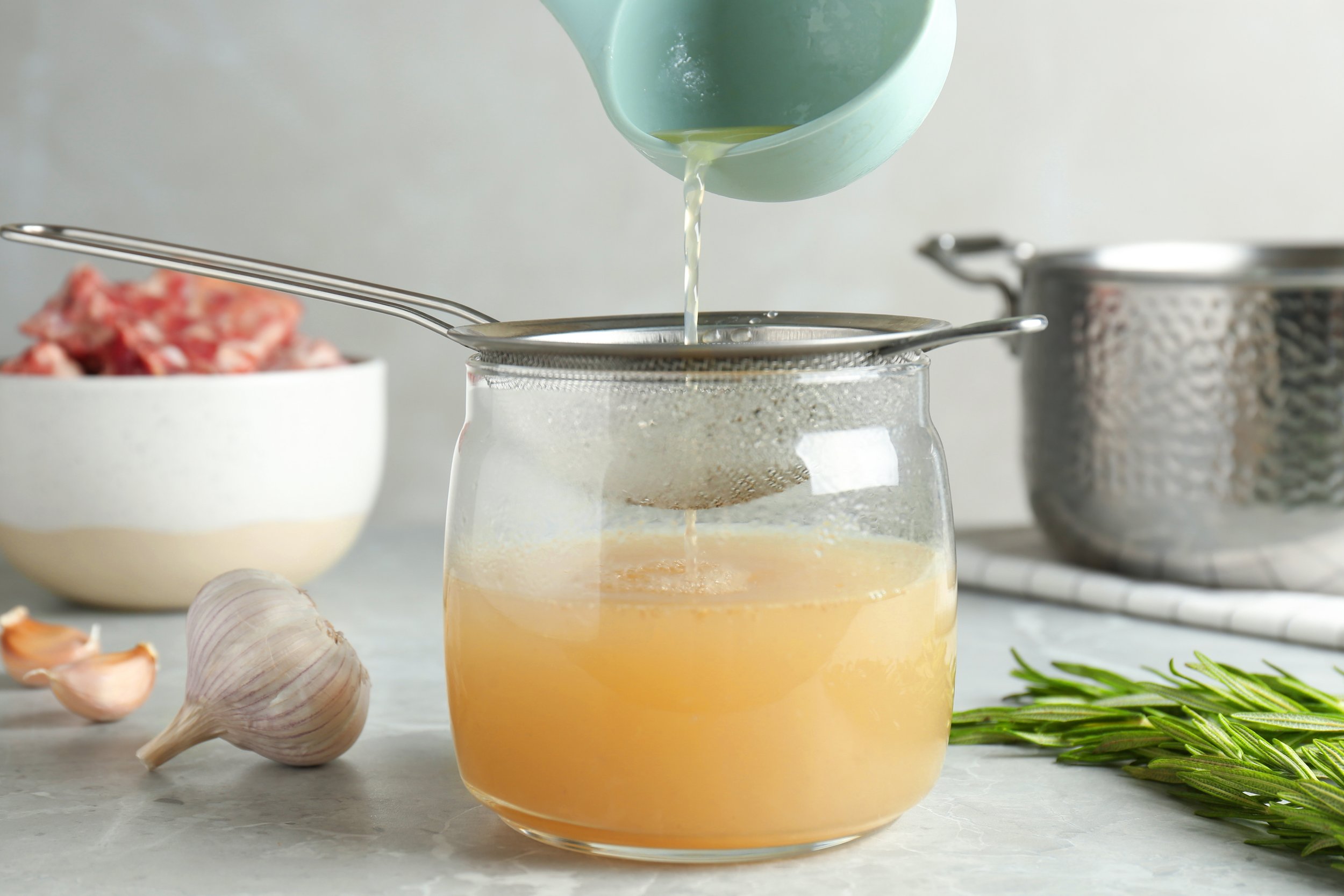 Fresh vegetables and fermented foods on a kitchen counter